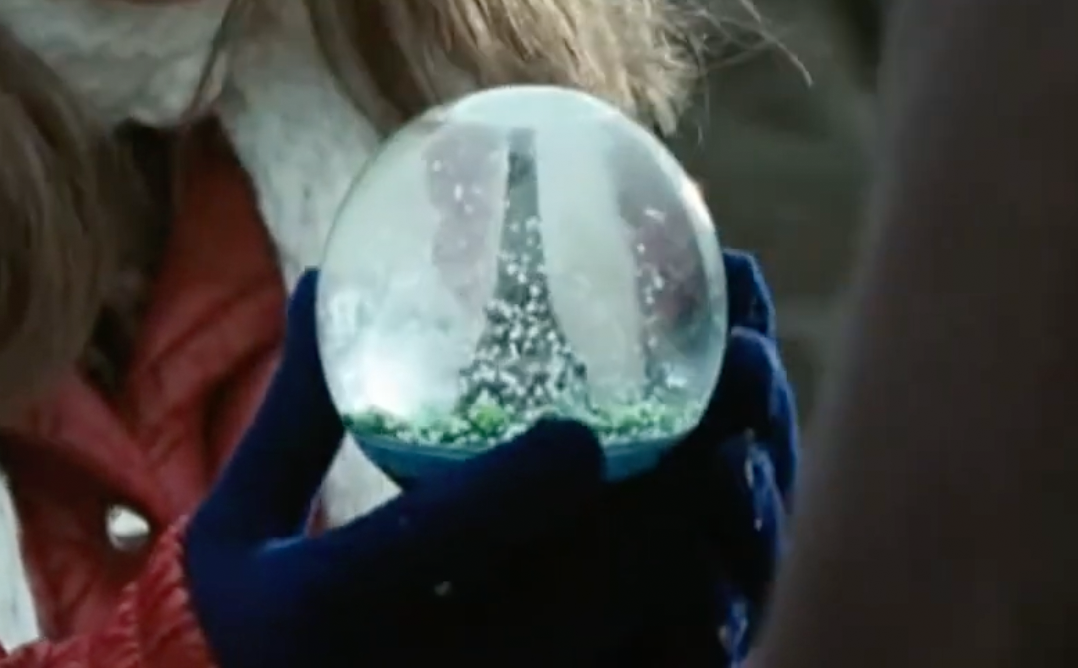 picture of a snow globe with a miniature Eiffel Tower inside